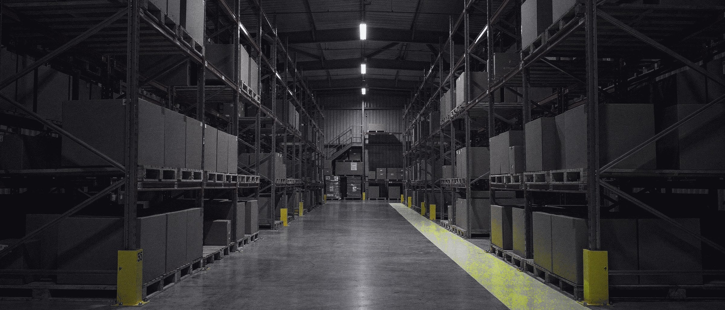 Warehouse racking aisle with a hi-vis floor line